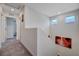 Upstairs hallway with carpet flooring and staircase leading to the lower level at 387 Larksong Ave, Henderson, NV 89011