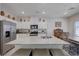 Bright kitchen with stainless steel appliances, white cabinets, and a large island with seating at 387 Larksong Ave, Henderson, NV 89011