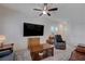Comfortable living room featuring a ceiling fan and tile floors at 387 Larksong Ave, Henderson, NV 89011