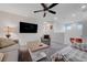 Relaxing living room featuring a large television and gray furnishings at 387 Larksong Ave, Henderson, NV 89011