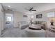 Comfortable living area with a couch, armchairs and a large ceiling fan at 387 Larksong Ave, Henderson, NV 89011