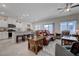 Open-concept living room and kitchen with modern finishes and comfortable seating at 387 Larksong Ave, Henderson, NV 89011