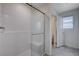 This bathroom features a sleek, modern shower with a glass door and tiled walls at 387 Larksong Ave, Henderson, NV 89011