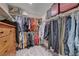 Spacious walk-in closet with ample storage shelves and hanging space for clothes at 387 Larksong Ave, Henderson, NV 89011