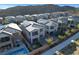 Scenic aerial view of a residential neighborhood showcasing homes with pools, solar panels, and well-kept yards at 40 Strada Moscato, Henderson, NV 89011