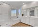Bathroom showcasing glass shower, soaking tub, double vanity, and natural light at 40 Strada Moscato, Henderson, NV 89011