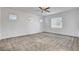 Large bedroom with three bright windows and neutral colored carpet at 40 Strada Moscato, Henderson, NV 89011