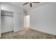 Bedroom featuring neutral carpet, a ceiling fan, and walk in closet at 40 Strada Moscato, Henderson, NV 89011