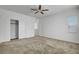 Bedroom features carpet, ceiling fan, large window, and closet at 40 Strada Moscato, Henderson, NV 89011
