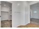 Walk-in closet featuring wood shelves and neutral carpet at 40 Strada Moscato, Henderson, NV 89011