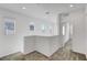 Upstairs hallway featuring neutral carpet, multiple windows, and recessed lighting at 40 Strada Moscato, Henderson, NV 89011