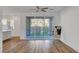 Hardwood floor living room with sliding glass doors and backyard views at 40 Strada Moscato, Henderson, NV 89011