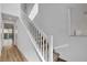 Bright staircase with wood floors, leading to the upper level of the home at 40 Strada Moscato, Henderson, NV 89011