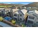Elevated view of the properties shows rear balconies, stone columns, and a pool at 40 Strada Moscato, Henderson, NV 89011