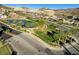 Neighborhood features a small pond and green spaces near the winding streets at 40 Strada Moscato, Henderson, NV 89011