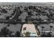 An aerial view shows the house with solar panels on the roof; it's located in a neighborhood at 4065 Genoa Dr, Las Vegas, NV 89141