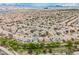 An aerial view shows the neighborhood with desert and mountain views at 4065 Genoa Dr, Las Vegas, NV 89141
