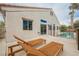 The home's backyard features patio seating and a fenced in swimming pool at 4065 Genoa Dr, Las Vegas, NV 89141