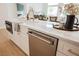 Elegant island with built in appliances and white cabinetry at 4065 Genoa Dr, Las Vegas, NV 89141