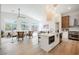 Open-concept living space with vaulted ceilings, natural light, and modern kitchen at 4065 Genoa Dr, Las Vegas, NV 89141