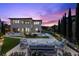 Backyard with a pool, spa, covered patio, comfortable seating, a grill, and a manicured lawn at 4220 San Alivia Ct, Las Vegas, NV 89141