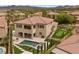 Backyard featuring a sparkling pool, outdoor seating area, and a well-manicured putting green at 4220 San Alivia Ct, Las Vegas, NV 89141