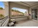 Private balcony featuring outdoor seating, offering a serene view of the natural surroundings at 4220 San Alivia Ct, Las Vegas, NV 89141