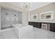Modern bathroom featuring a soaking tub, glass-enclosed shower, and well-lit vanity area at 4220 San Alivia Ct, Las Vegas, NV 89141