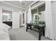 Bedroom featuring a modern work desk and sliding glass doors that provide abundant natural light at 4220 San Alivia Ct, Las Vegas, NV 89141