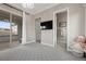 Bedroom featuring a slider to the balcony, TV, and doorway to the ensuite bathroom at 4220 San Alivia Ct, Las Vegas, NV 89141