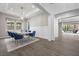 Bright dining room featuring a modern table set, wainscoting, and a view of the backyard at 4220 San Alivia Ct, Las Vegas, NV 89141