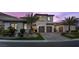 Charming two-story home featuring a three-car garage, desert landscaping and mountain views at 4220 San Alivia Ct, Las Vegas, NV 89141