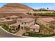 Beautiful single-Gathering home with desert landscaping, tile roof, and multi-car garage at 4220 San Alivia Ct, Las Vegas, NV 89141