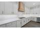 Well-equipped kitchen with gas range and matching white cabinetry at 4220 San Alivia Ct, Las Vegas, NV 89141