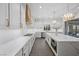 Modern kitchen featuring stainless steel appliances, granite countertops, and wooden floors at 4220 San Alivia Ct, Las Vegas, NV 89141