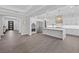 Spacious kitchen with stainless steel appliances, large island, and modern lighting fixtures at 4220 San Alivia Ct, Las Vegas, NV 89141