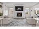 Inviting living room features a fireplace, large TV, and comfortable seating at 4220 San Alivia Ct, Las Vegas, NV 89141