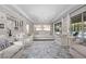 Expansive living area with plush seating, stylish decor, seamless flow to the outdoor pool and patio for luxurious living at 4220 San Alivia Ct, Las Vegas, NV 89141