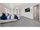 Spacious main bedroom with tray ceilings, recessed lights, and a decorative chandelier at 4220 San Alivia Ct, Las Vegas, NV 89141