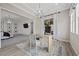 Well-lit home office with a sleek desk, complemented by an airy, open floor plan and stylish decor at 4220 San Alivia Ct, Las Vegas, NV 89141