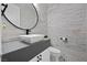Chic powder room featuring a vessel sink, modern fixtures, and textured stone wall at 4220 San Alivia Ct, Las Vegas, NV 89141