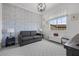 Stylish room with designer wallpaper, plush carpeting, and ample natural light at 4220 San Alivia Ct, Las Vegas, NV 89141