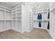 Organized walk-in closet with custom shelving and ample storage for clothing and accessories at 4220 San Alivia Ct, Las Vegas, NV 89141