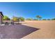 Expansive backyard featuring decorative rock, palm trees, privacy wall and trampoline at 4260 Helena Cove Ct, Las Vegas, NV 89129