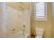 Bathroom with white tiled shower and window with white shutters at 4260 Helena Cove Ct, Las Vegas, NV 89129