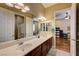 Bathroom with double sink vanity and door to another bathroom with shower at 4260 Helena Cove Ct, Las Vegas, NV 89129