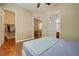 Spacious bedroom leads to a walk-in closet and bathroom, featuring hardwood floors and neutral tones at 4260 Helena Cove Ct, Las Vegas, NV 89129