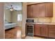 The well-lit bonus room includes a kitchenette with modern appliances and a cozy bedroom area at 4260 Helena Cove Ct, Las Vegas, NV 89129