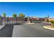 The Woodland Crest community is gated with an ornamental iron automatic gate and professionally landscaped entry at 4260 Helena Cove Ct, Las Vegas, NV 89129