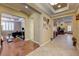 Open-concept foyer with tile and hardwood flooring, offering access to office, living room, and dining room at 4260 Helena Cove Ct, Las Vegas, NV 89129